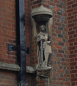 Saint George at the corner of house and Saint Francis church January 2008
